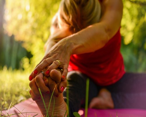 Man stretching and relaxing outdoors to release tension